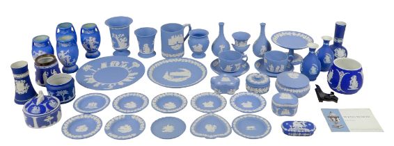 A large group of Wedgwood blue jasperware, including vases, plates, two cups and saucers, comport,