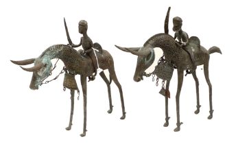 A pair of bronze metal sculptures, Nigerian, mid 20th century, modelled as mounted horsemen with