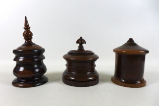 Three exotic wood lidded jars including a Lignum Vitae string jar, tea caddy and tobacco jar 24cm