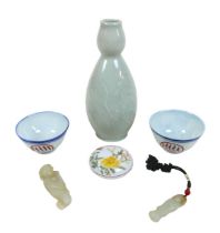 A group of Oriental items to include two wine cups, a lidded pigment pot, a celadon vase and two