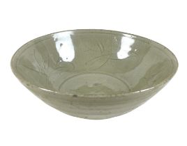 A Chinese Longquan-type celadon bowl, decorated incised decoration of leaves to the inside,
