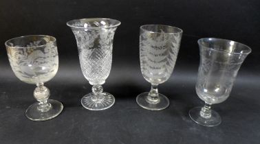 A group of four clear glass 19th century presentation vases / goblets, comprising one celery vase