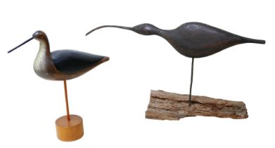 A carved wooden figure of a Curlew in the manner of Guy Taplin, 65 by 33cm high, and another of a