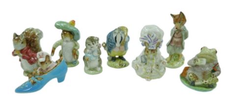 Eight Beswick Beatrix Potter animal character figurines, including 'The old woman who lived in a
