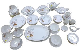 A KPM china part dinner, tea and coffee, service, decorated with leaves, numbered '730 25',