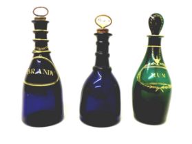 A group of three 18th century glass decanters, comprising a Bristol green decanter, with gilt