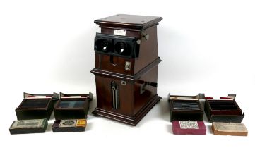 A French early 20th century tabletop stereoscope viewer by L. Gaumont & Cie, mahogany cased with