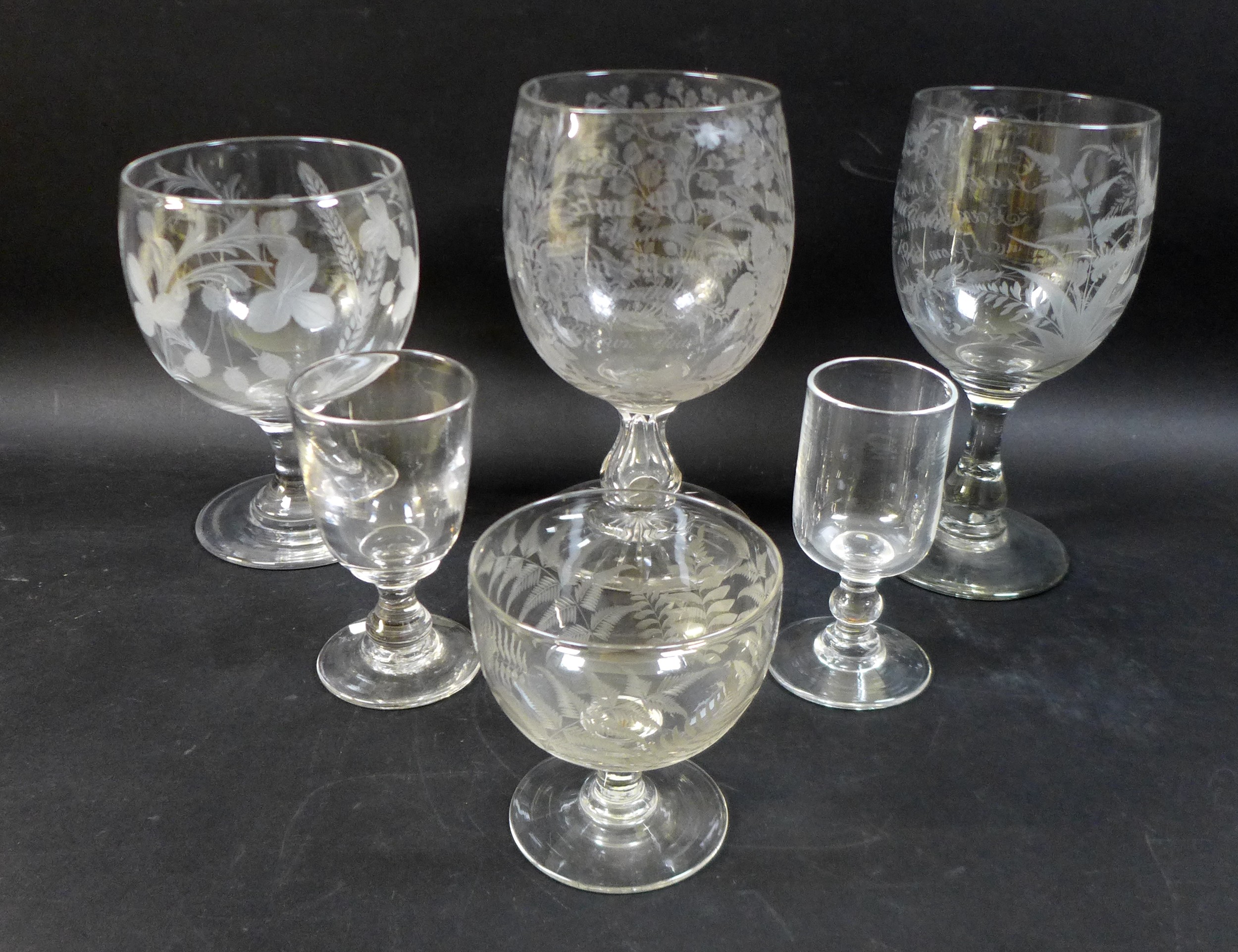 A group of three clear glass 19th century presentation vases / goblets, comprising one engraved