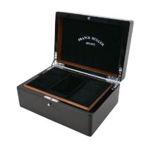 An exotic wood watch box, branded for 'Franck Muller, Geneve', with fitted interior and chromed