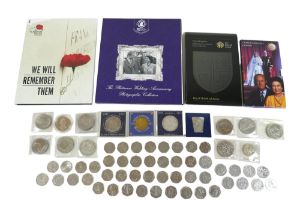 A collection of commemorative coins, including forty seven 50 pence pieces and the United Kingdom