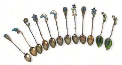 A set of ten Marius Hammer, Bergen, Norway silver gilt plique a jour spoons