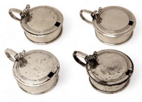 A group of four silver mustards, two with glass liners, each 10 by 7.5 by 4.5cm high, 18.2toz. (4)