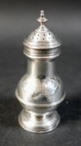 A Georgian silver pepperette, with engraved initials 'T.H' to the body, 2.03toz, 10.5cm high.