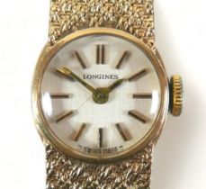 A vintage Longines 9ct gold lady's cocktail watch, circular silvered dial, black and gold batons and