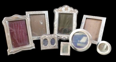 Eight silver photograph frames, including a pair of George V frames, W J Myatt & Co. Birmingham