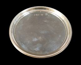 An Elizabeth II silver coaster tray, circular with beaded rim, Barker Ellis Co, Birmingham 1996, 4.