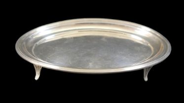 A George V silver oval tray, with reeded rim, raised on four feet, George Nathan & Ridley Hayes,