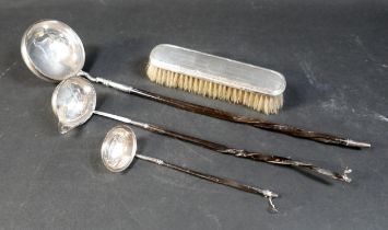 Three silver toddy ladles, the smallest ladle, 18cm long overall, the middle sized ladle, 31cm