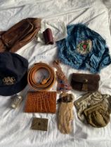 A mixed collection of purses, cap, material, leather belt, bags, bead work etc