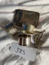 3 Silver napkin rings, silver card case and white metal boat