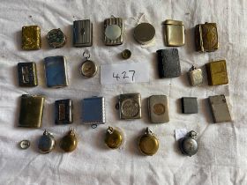 A collection of vestas, matchbox holders, sovereign cases and compasses