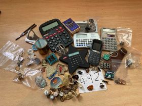 Cufflinks, badges, brooches, pins, calculators etc