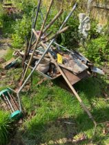 Wheelbarrow and tools.