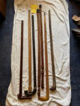 African carved walking sticks and a buffalo carved stick
