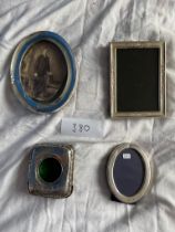 3 silver frames and a silver pocket watch frame