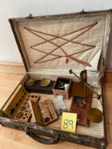 A suitcase of scales, weights etc