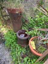 A group of chimney pots and planters.