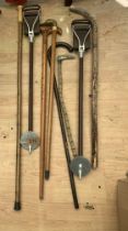 2 Shooting sticks and a number of walking sticks