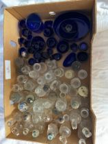 A collection of blue liners, cruet and other glass bottles
