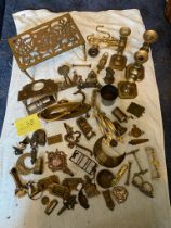 Collection of brass door furniture, candlesticks etc