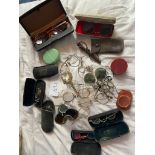 A collection of glasses including monocles, lunettes and cases etc