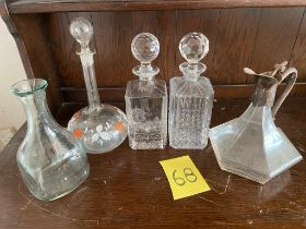 Collection of 5 decanters including one plated, one painted glass, one etched and 1 cut glass