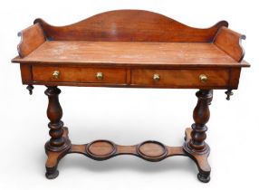 A Victorian mahogany washstand with two drawers on turned supports and an undertaker, 118cm by