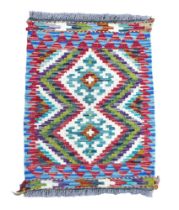 Small geometric hand knotted woollen carpet mat, 64 by 48cm.