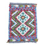 Small geometric hand knotted woollen carpet mat, 64 by 48cm.