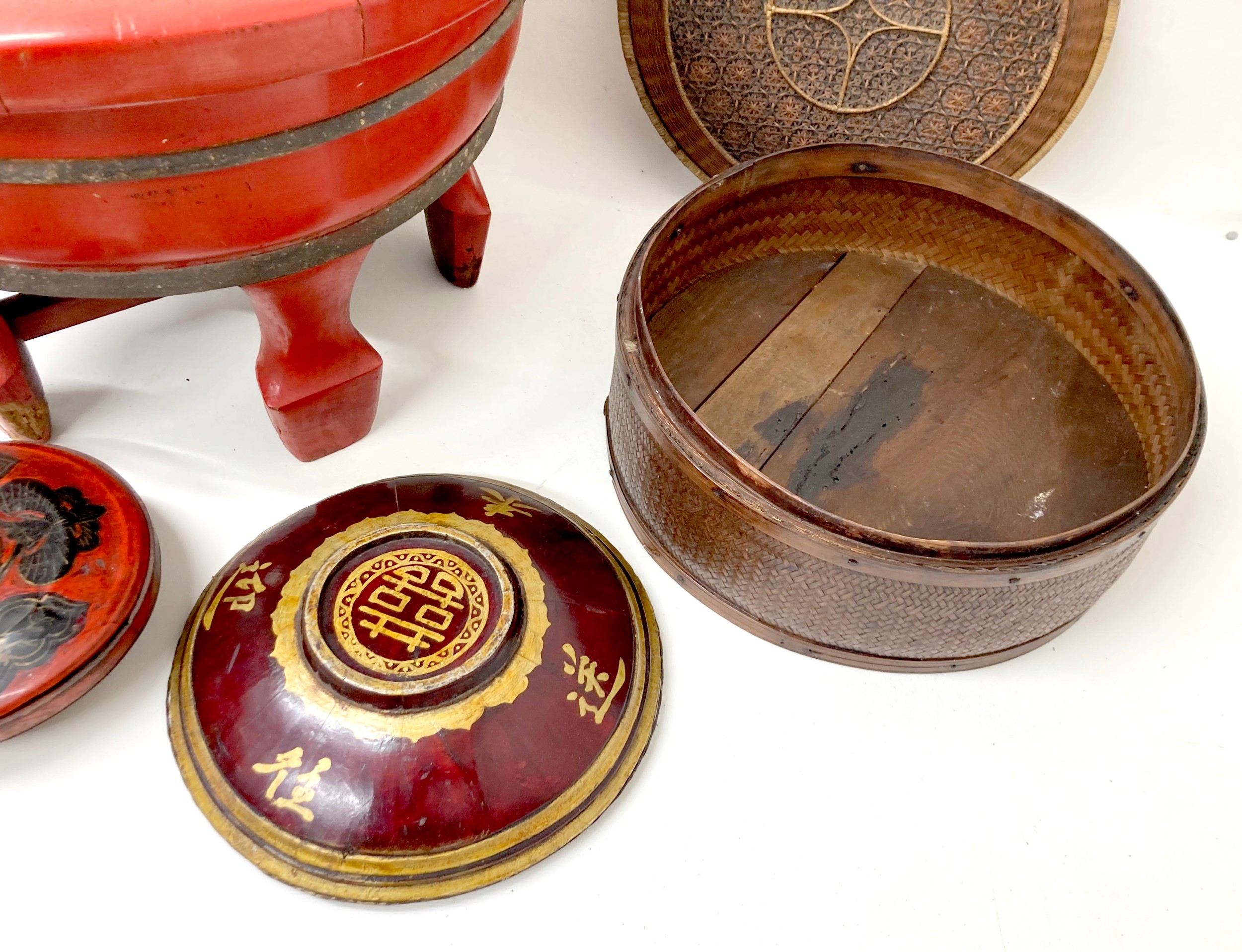 A collection of eight Chinese wooden and rattan bowls, the largest painted red and raised on four - Image 4 of 7