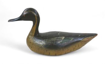 A well carved and painted decoy duck, 35cm by 13cm by 17m tall.