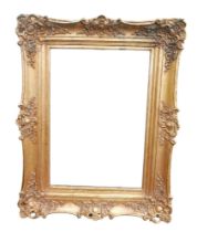 A modern ornate gilt framed rectangular mirror