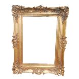 A modern ornate gilt framed rectangular mirror