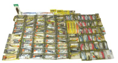 A collection of one hundred and eleven bait fishing lures, the majority by Shakespeare and boxed. (