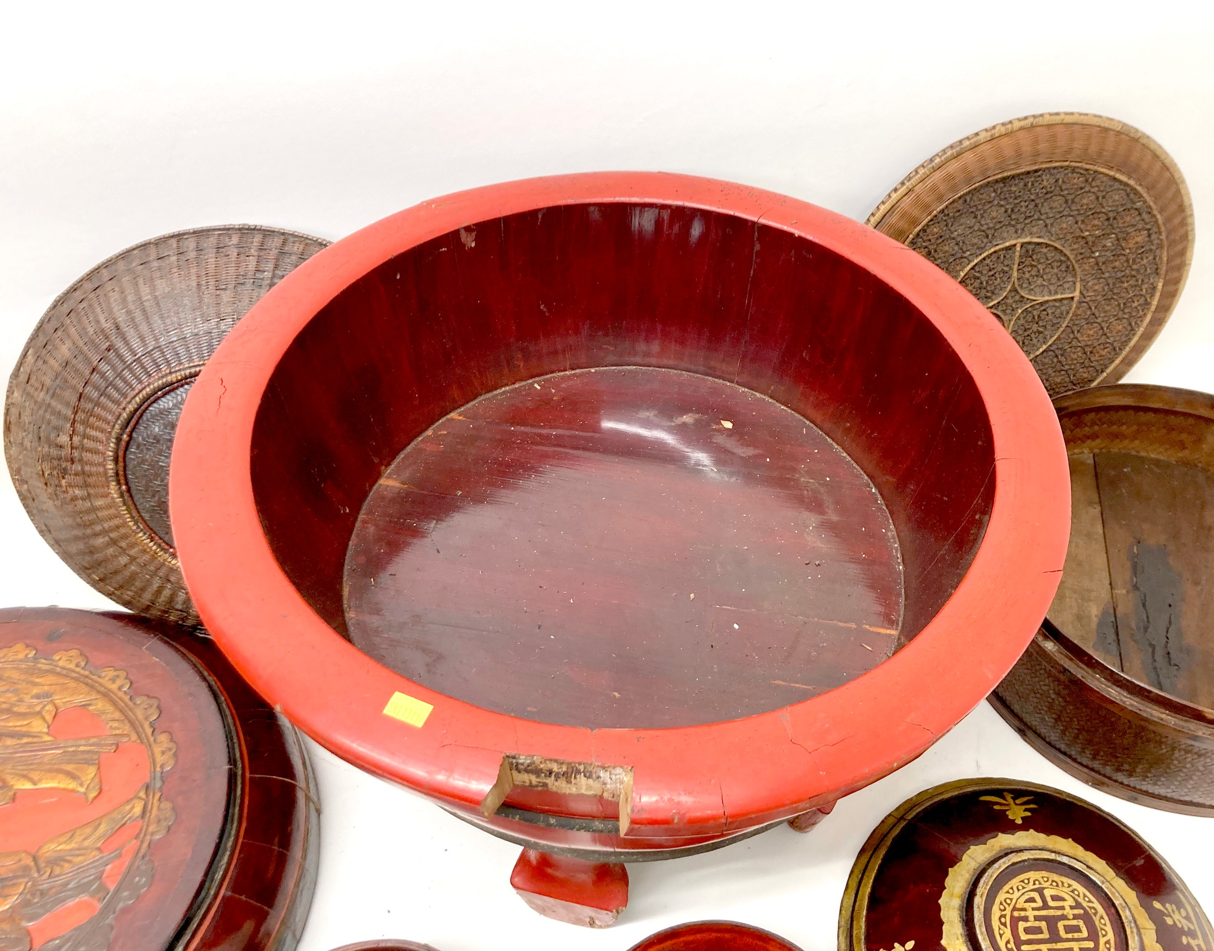 A collection of eight Chinese wooden and rattan bowls, the largest painted red and raised on four - Image 2 of 7