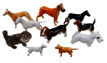 Nine Beswick figurines of dogs, including a Great Dane, 17cm high, and a Basset hound, together with
