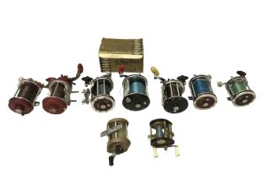 A Penn surfmaster sea fishing reel and eight other sea reels.