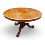 A Victorian Burr walnut breakfast table, with tilt top and raised on three cabriole scroll feet,