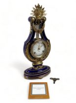 A porcelain and ormolu Marie-Antoinette lyre shaped clock sold by the Victoria and Albert Museum,