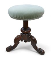A Victorian carved walnut revolving piano music stool, 43cm by 43cm by 44cm.